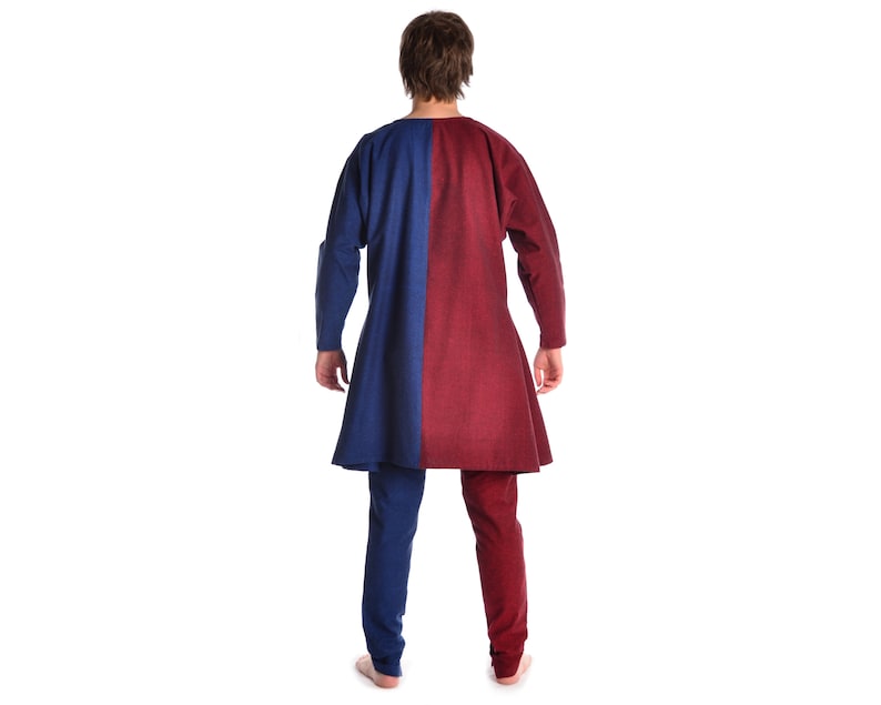 May include: A long-sleeved tunic with a blue and red color block design. The tunic has a long, flowing hem and is made of a soft, comfortable fabric.