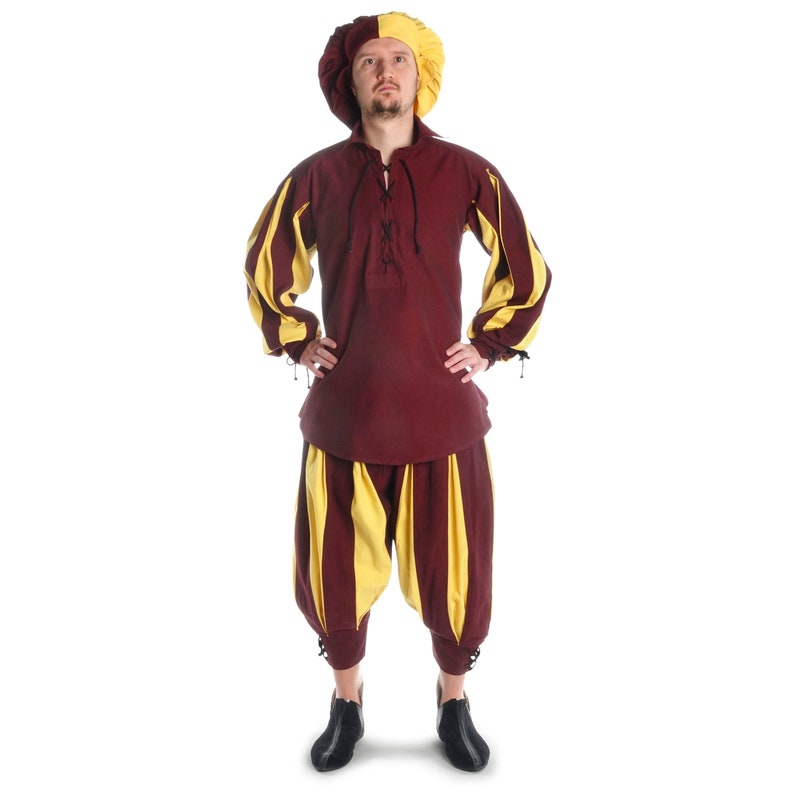 May include: A person wearing a burgundy and yellow striped costume with a yellow and burgundy hat. The costume includes a long-sleeved shirt and pants.