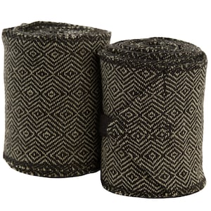 May include: Two rolled fabric bandages. The bandages are dark brown with a repeating diamond pattern in a lighter beige colour. The fabric appears thick and textured. The bandages are likely used for support or protection.