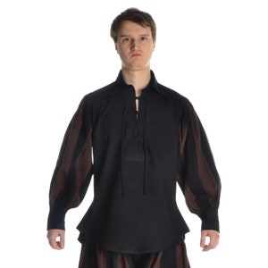 May include: A black long-sleeved shirt with brown and black striped sleeves. The shirt has a lace-up neckline and a fitted silhouette.
