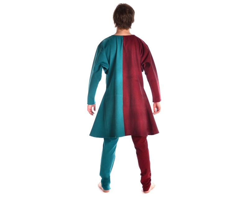 May include: A long tunic with a teal and burgundy color scheme. The tunic has a long, flowing shape and is made of a soft, comfortable fabric.