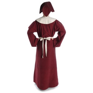May include: A long, burgundy robe with a white collar and a white sash. The robe has long sleeves and a hood.
