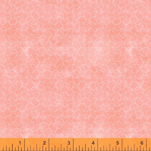 May include: A pink fabric with a white abstract pattern of overlapping circles and ovals. The fabric is measured with a ruler in inches.