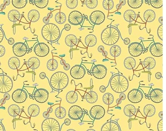 Bicycles in pale yellow is a tossed design from the Be My Neighbor collection by Terri Degenkolb for Windham Fabrics