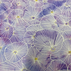 May include: Close-up of a fabric with a repeating floral pattern. The design features white, radial lines emanating from yellow centers, set against a watercolor-style background of purple and lavender hues. The fabric has a soft, textured appearance.