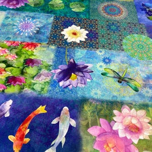 May include: A vibrant, patchwork-style fabric featuring watercolor illustrations of koi fish, lotus flowers, and dragonflies. The design incorporates shades of blue, green, purple, pink, and orange, creating a serene and artistic aesthetic. The fabric is likely suitable for quilting or home decor projects.