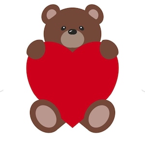 Urso segurando um cortador de biscoitos de coração