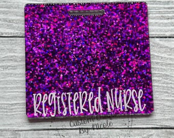 May include: Purple glitter badge with the text "Registered Nurse" in white lettering.