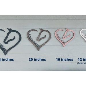 May include: Four wooden horse head heart-shaped signs in different sizes and colors. The signs are 24 inches, 20 inches, 16 inches, and 12 inches. The signs are personalized with the names "Lil Sebastian", "Rocmanite", "Dallas", and "Argo".
