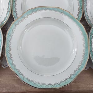 Set of 12 Longwy France earthenware soup plates, Trianon model