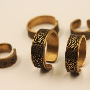 Brass rings with traditional Baltic ornaments