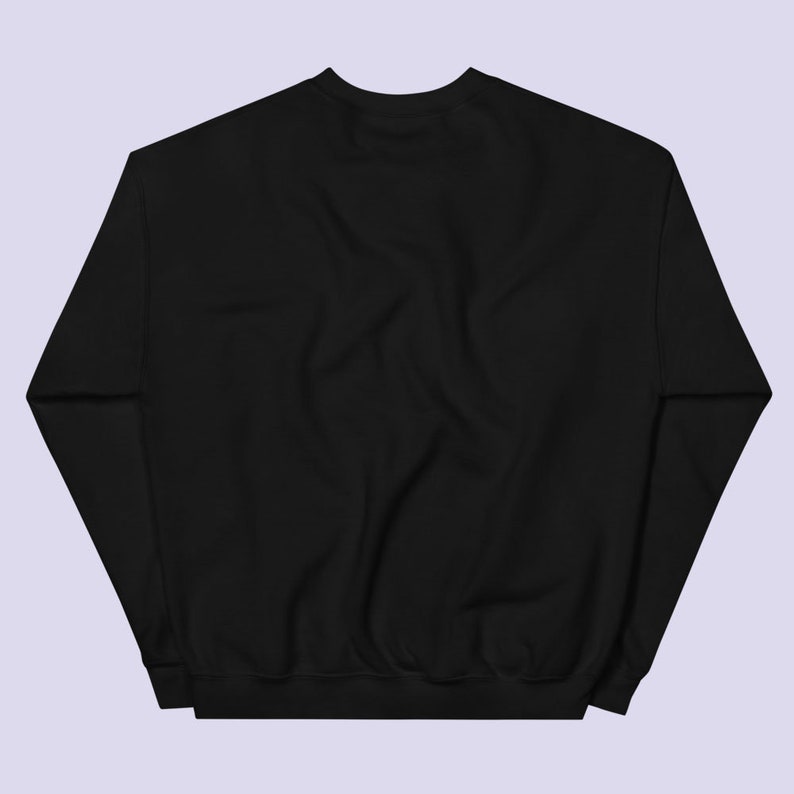 May include: A black sweatshirt with long sleeves and a crew neck.