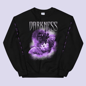 May include: Black sweatshirt with a purple bat and castle graphic. The text "DARKNESS" is printed in white on the front of the sweatshirt.