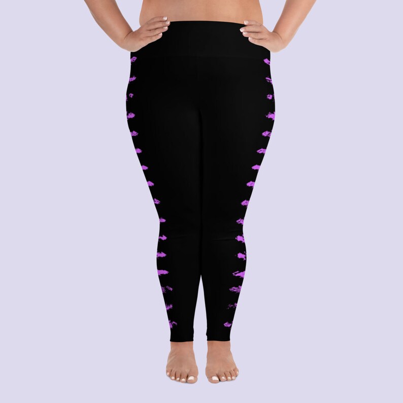 May include: Black leggings with a purple abstract pattern on the sides.
