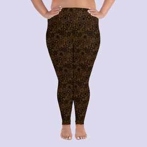 May include: Brown leggings with a black gear pattern.