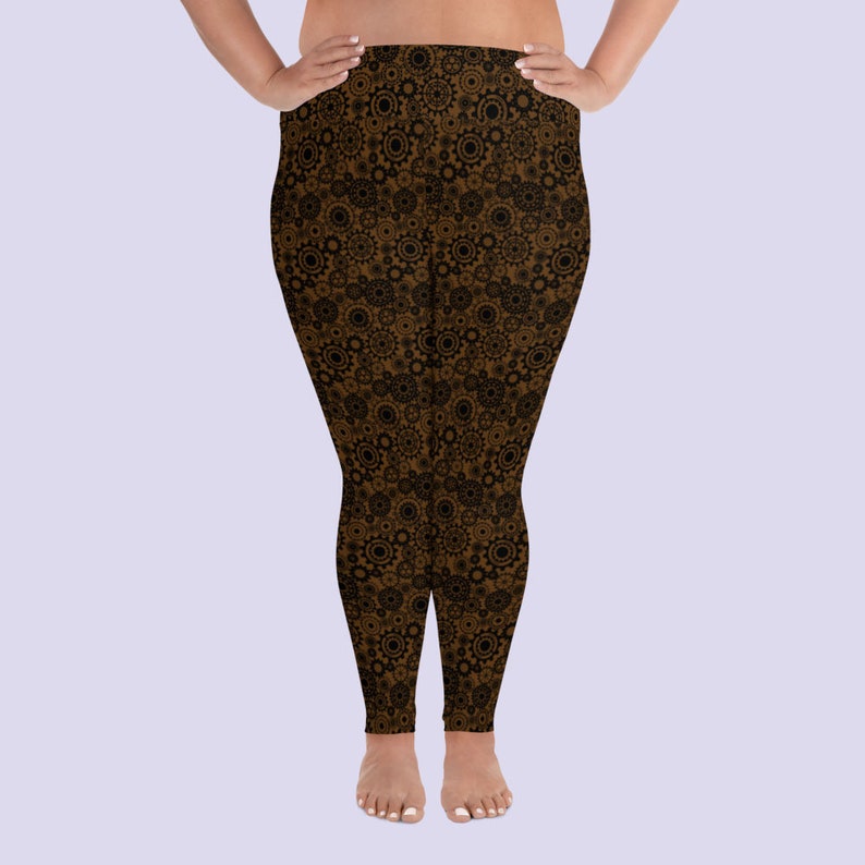May include: Brown leggings with a black gear pattern.