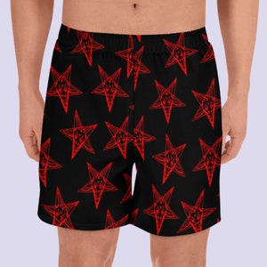 May include: Black athletic shorts with a red pentagram pattern.