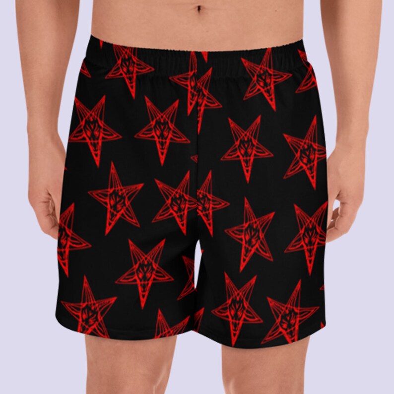 May include: Black athletic shorts with a red pentagram pattern.
