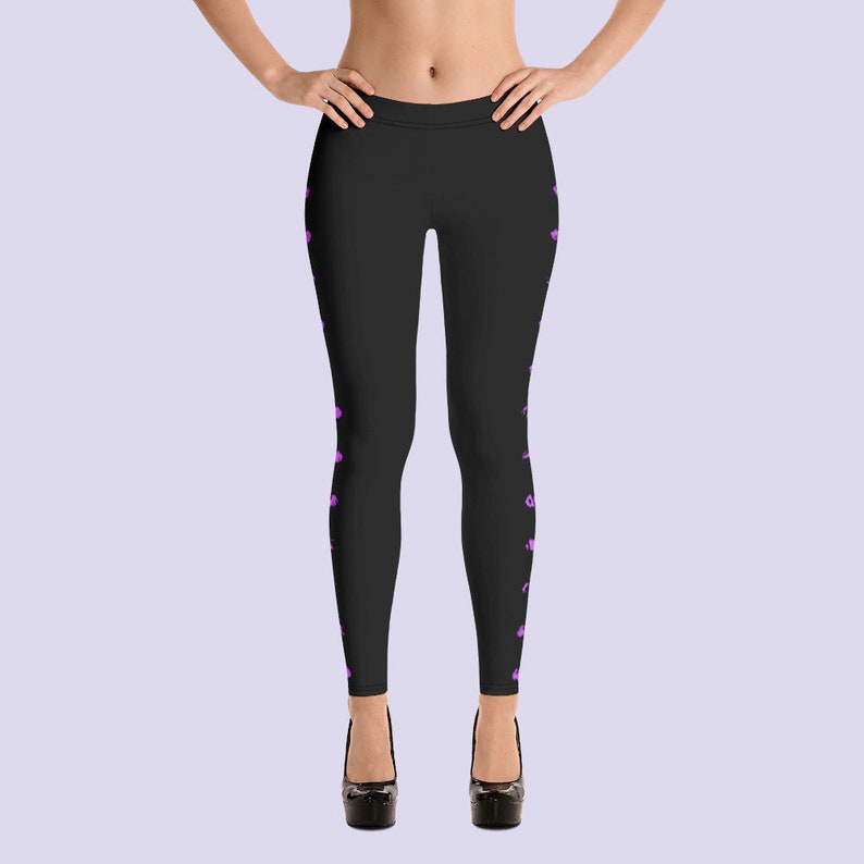 May include: Black leggings with a pink floral pattern on the sides.