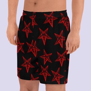 May include: Black athletic shorts with a red pentagram pattern.