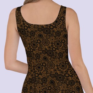 May include: A brown sleeveless dress with a black and brown gear pattern.