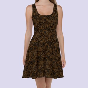 May include: A brown skater dress with a black and brown gear pattern.
