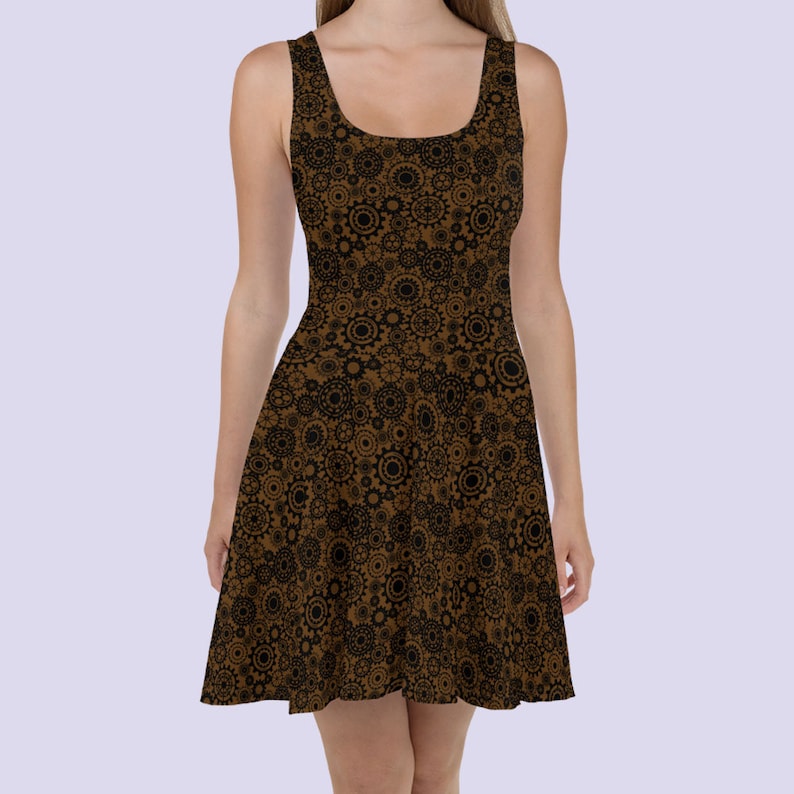 May include: A brown skater dress with a black and brown gear pattern.