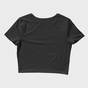 May include: A black cropped t-shirt with short sleeves.