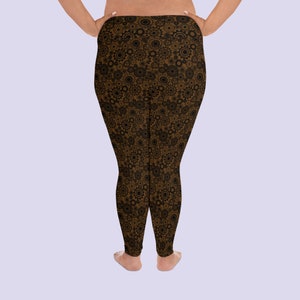 May include: Brown leggings with a black and brown gear pattern.