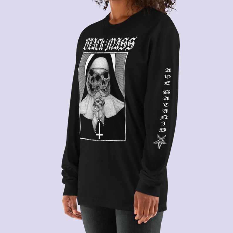 May include: Black long-sleeve shirt with a white graphic of a nun with two skulls and the text "BLACK MASS" on the front. The left sleeve has the text "AVE SATANIS" and a pentagram.