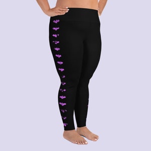 May include: Black leggings with a purple bat print down the side.