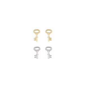 Puede incluir: Un par de pendientes en forma de llave en oro y plata. Los pendientes son pequeños y delicados, y serían un gran regalo para un amigo o un ser querido.