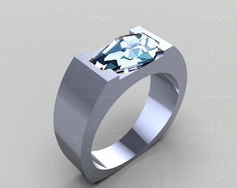 May include: A silver ring with a large, clear, faceted gemstone set in a bezel setting. The gemstone is a pear shape and has a blue hue. The ring is a simple design with a flat band.