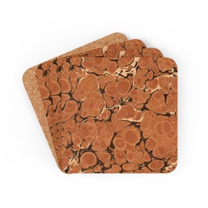 May include: Set of three square coasters with a cork base. The top surface features a brown and black marbled pattern. The coasters are designed to protect surfaces from drink condensation and heat.