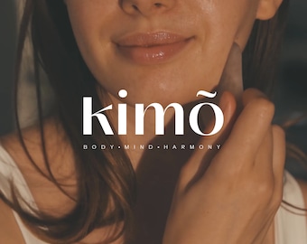 May include: A woman is using a white jade roller on her face. The text "kimó BODY.MIND.HARMONY" is displayed below the image.
