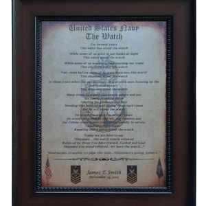 May include: A framed poem titled "The Watch" honoring the service of a United States Navy sailor. The poem is written in a vintage style font and includes the text "For twenty years this sailor has stood the watch." The frame is brown wood with a gold trim. The bottom of the frame includes the name "James T. Smith" and the date "November 23, 2015".
