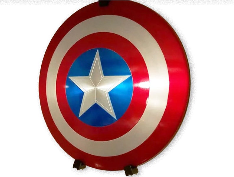 May include: A red, white, and blue Captain America shield with a five-pointed star in the center. The shield is made of metal and has a shiny finish.