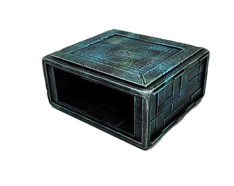 May include: A dark green and blue miniature dungeon or building with a brick exterior and a hollow interior. The miniature is made of resin and is designed for tabletop gaming.