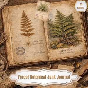 May include: An open vintage journal with botanical illustrations of ferns. The journal features the text "Male Fern" and "Forest Botanical Junk Journal". The journal has 35 pages and is on a wooden surface.