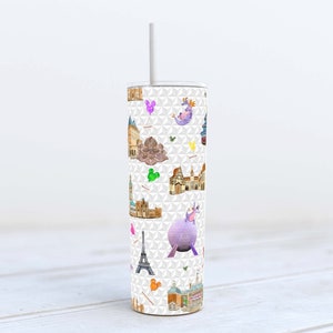 May include: White tumbler with a colorful pattern of Disney World landmarks and characters. The pattern includes Cinderella's Castle, Spaceship Earth, and Mickey Mouse.