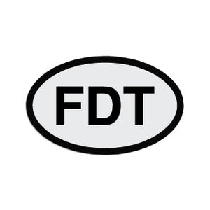 May include: White oval sticker with a black border and the text "FDT" in black.