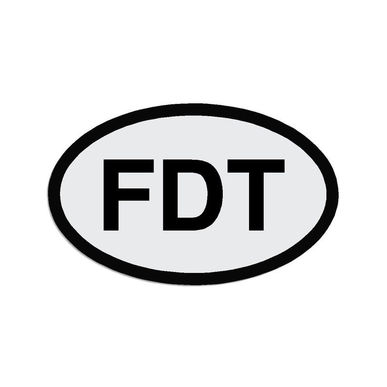 May include: White oval sticker with a black border and the text "FDT" in black.