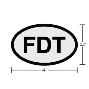 May include: White oval sticker with a black outline and the text "FDT" in black letters. The sticker is 4 inches wide and 2.5 inches tall.