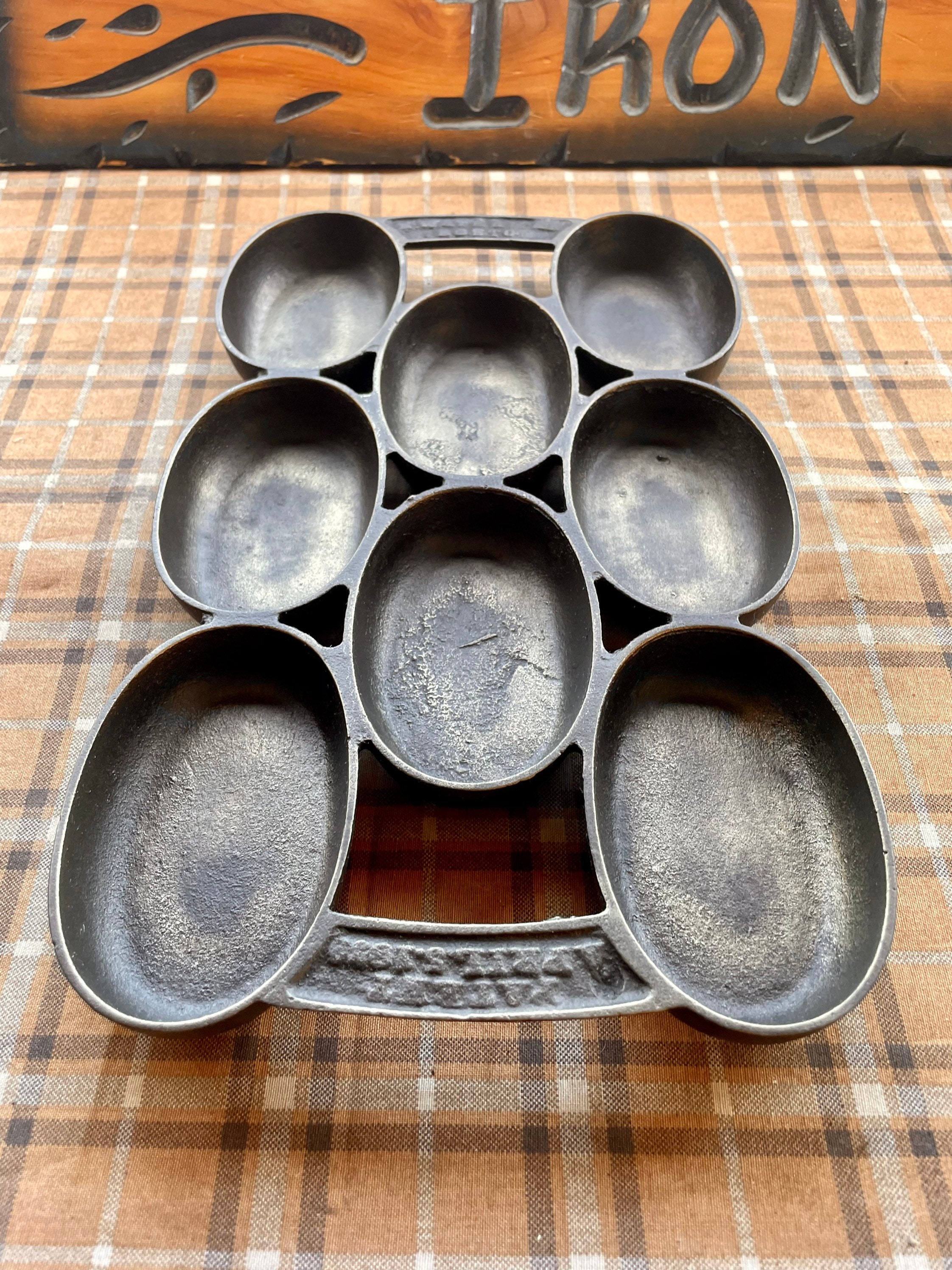 Sold at Auction: N WATERMAN CAST IRON OVAL MUFFIN PAN, BOSTON