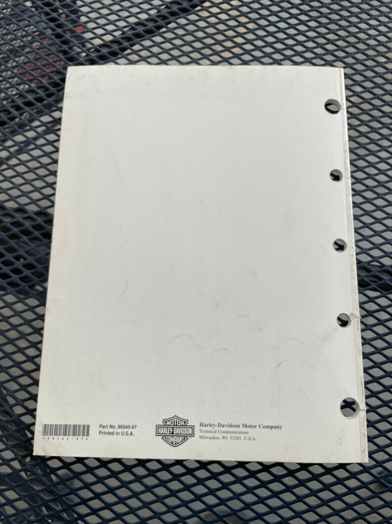 May include: A white Harley-Davidson motorcycle service manual with the Harley-Davidson logo and the text "Part No. 99545-97 Printed in U.S.A." and "Harley-Davidson Motor Company Technical Communications Milwaukee, WI 53201 U.S.A."