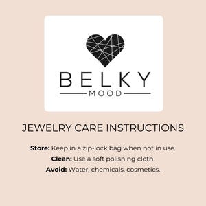 May include: A square white card featuring a black heart logo with a geometric line pattern above the text BELKY MOOD. Below, the text reads JEWELRY CARE INSTRUCTIONS with bullet points for Store: Keep in a zip-lock bag, Clean: Use a soft polishing cloth, and Avoid: Water, chemicals, cosmetics.