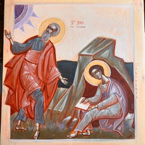 May include: An icon painting depicting two figures with halos. One figure, in red and gray robes, gestures towards the other, who is seated and writing. The text "ST JOHN THE THEOLOGUE" is visible. The background features a sun and rock formations.