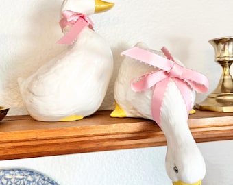 Pair of Ceramic Geese Figurines with Pink Bows
