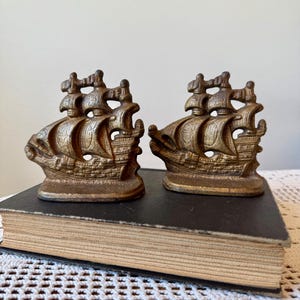 Vintage Cast Iron Ship Bookends Pair | Gold tone painted metal nautical boat bookends