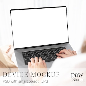 May include: A person using a silver laptop with a blank white screen. The laptop is on their lap and they are typing on the keyboard.